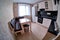 Contemporary black and white kitchen with functional cupboards and modern equipment fisheye photo