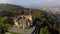 Contemporary castle aerial shot, fairy tale yellow building, fog