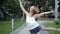 Contemporary caucasian ballet street dancer woman urban dancing freestyle in the city