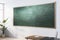 Contemporary classroom interior with empty mock up chalkboard, wooden furniture, window, daylight and equipment. Education,