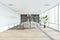 Contemporary coworking office interior with concrete wall, wooden flooring, windows with city view, sunlight, shadows and