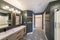 Contemporary craftsman master bathroom design with dark gray interior