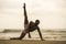 Contemporary dance choreographer and dancer doing ballet beach workout . a young attractive and athletic black African American