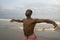 Contemporary dance choreographer and dancer doing ballet beach workout . a young attractive and athletic black African American