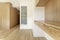 Contemporary designed bedroom with custom oak door closet, skylight leading to ensuite bathroom, raw concrete beams, wall-mounted