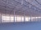 Contemporary empty white warehouse illuminated by sunlight interior 3d illustration