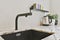 Contemporary faucet with black sink