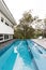 Contemporary fully tiled swimming pool in mid century modern home