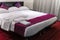 Contemporary hotel room suite queen size bed