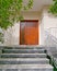 Contemporary house entrance brown wooden door, Athens Greece