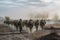 contemporary infantry army on march, rear view of soldiers moving on foot on dusty field, neural network generated