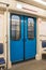 Contemporary inside space of the underground railway carriage with empty seats.