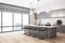 Contemporary kitchen interior with concrete wall, wooden floor, city view, equipment and spherical lamps. Luxurious lifestyle