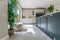 Contemporary kitchen with light grey chevron tiles and blue and white cabinets