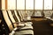 Contemporary lounge with seats in the airport during sun set or