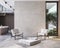 Contemporary minimalist interior with armchairs, coffee table, wood panel, blank wall.