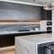 A contemporary, monochromatic kitchen with sleek stainless steel appliances and a marble waterfall island3, Generative AI