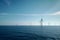 Contemporary offshore wind turbines in the sea. Renewable energy sources concept