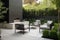 contemporary outdoor patio with sleek furniture, greenery and outdoor fireplace