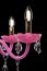 Contemporary pink glass chandelier isolated on black background. close-up chandelier.