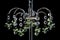 Contemporary silver chandelier isolated on black background. Crystal chandelier close-up