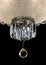 Contemporary silver chandelier isolated on black background. Crystal chandelier close-up