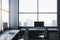 Contemporary spacious dark coworking office interior with panoramic windows and city view. Workplace concept.