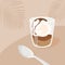 Contemporary square card with affogato coffee dessert with ice cream and spoon on table in cafe. Trendy minimalist