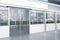 Contemporary storefront with empty white wide mock up banner and city window reflections. 3D Rendering