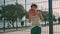 Contemporary teen spinning ball stadium. Basketball player demonstrating skills