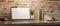 Contemporary vintage workspace with laptop empty screen mockup over brick wall