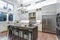 Contemporary white kitchen with high-end kitchen appliances