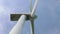 Contemporary windmill blades rotate as clean energy source