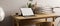 Contemporary working space in living room apartment, white brick wall, wood table, tablet blank screen