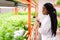 Contemporary young female biologist making research notes in document