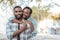 Content African couple standing together outside on a sunny day