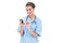 Content brown haired nurse in blue scrubs using a mobile phone