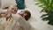 content caucasian couple celebrating Valentine's Day laying on the floor, looking at each other, and smiling