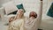 content caucasian couple celebrating Valentine's Day laying on the floor, looking up, and smiling