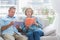 Content couple reading books on the couch