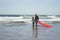 Content father and daughter doing sports on beach