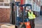 Content forklift driver with forklift