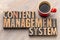 Content management system - word asbtract in wood type