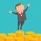 Contented businessman is jumping above gold coins
