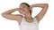 Contented happy young woman stretching her arms while walking on white background.