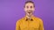 Contented surprised man looks at the camera in shock. Young adult isolated on purple background. 4K