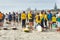 Contestants and spectators for the Generation Homes Sand to Surf swim event on overcast day