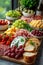 A continental breakfast - colorful assortment of fruits, cheeses, cold cuts and bread