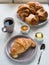 Continental breakfast with French croissants, butter, jam, black