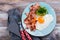 Continental breakfast with fried eggs, bacon and avokado